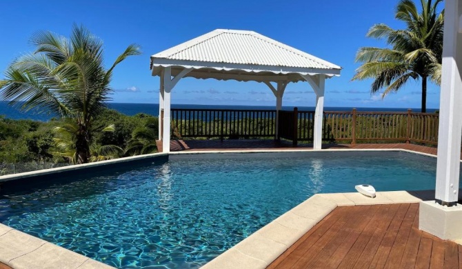 Villa de 4 chambres avec vue sur la mer piscine privee et jardin clos a Le Moule a 1 km de la plage