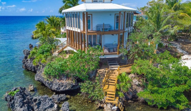 Awesome over the water overlooking West End - Aire Agua home