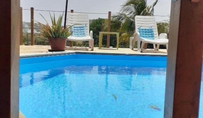 Maison d'une chambre avec piscine partagee jardin clos et wifi a Sainte Anne a 4 km de la plage